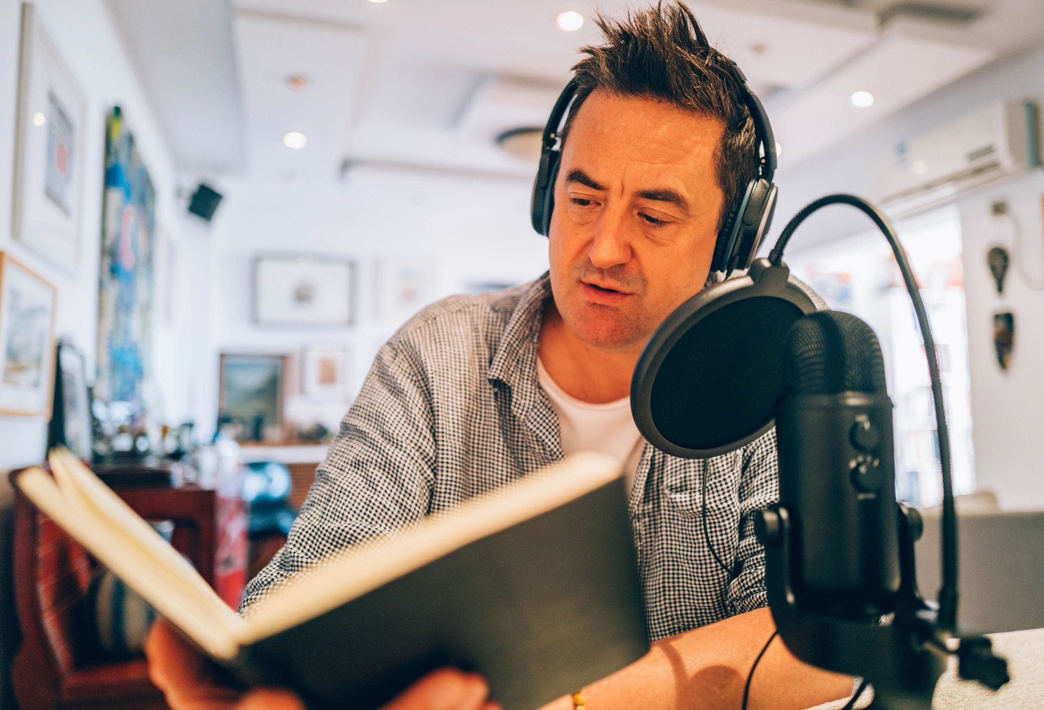 Adult practicing vocals in a studio